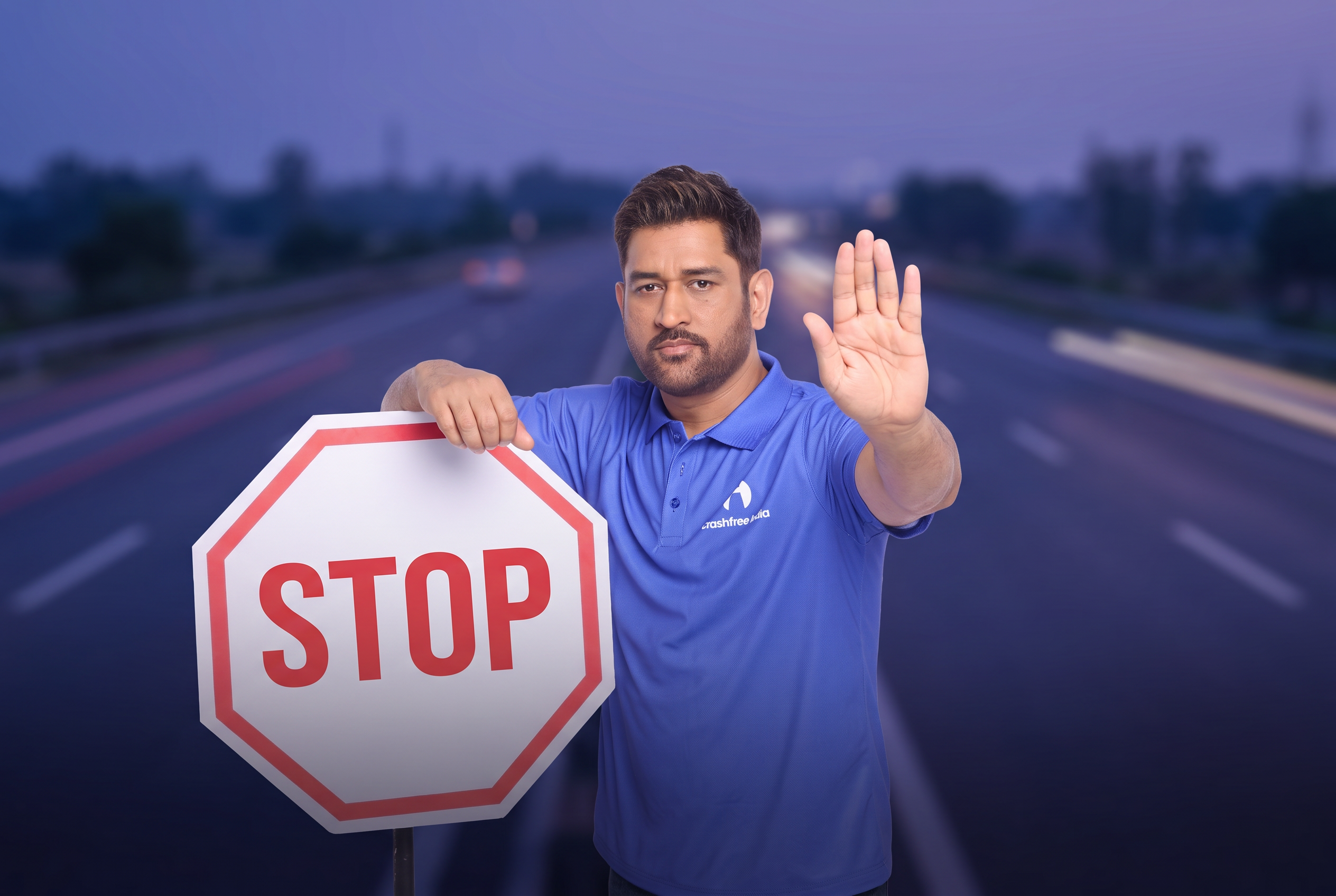 MS Dhoni holding a STOP sign, urging safer roads for a Crashfree India